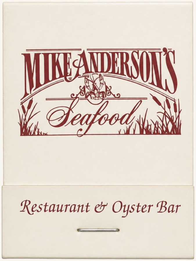 A cream matchbook printed in dark red: Mike Anderson's Seafood, Restaurant and Oyster Bar.