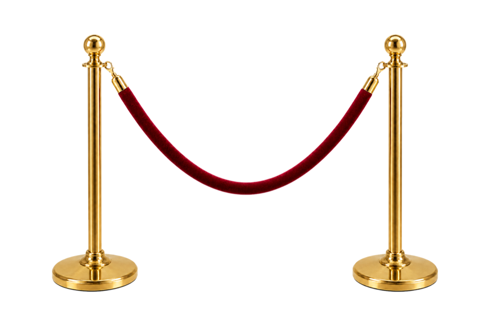 Two brass stanchions joined by a red velvet rope.